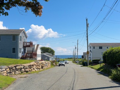 Peaceful coastal street with ocean views just down the road