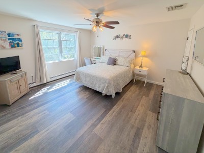 Bright, spacious bedroom with natural light and calming coastal style