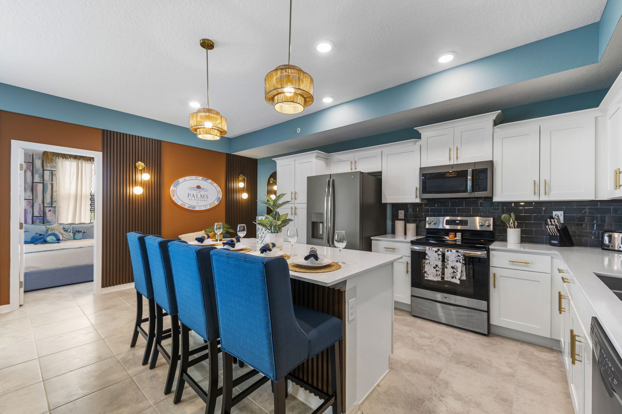 Stylish modern kitchen with island seating, stainless appliances, and bold design