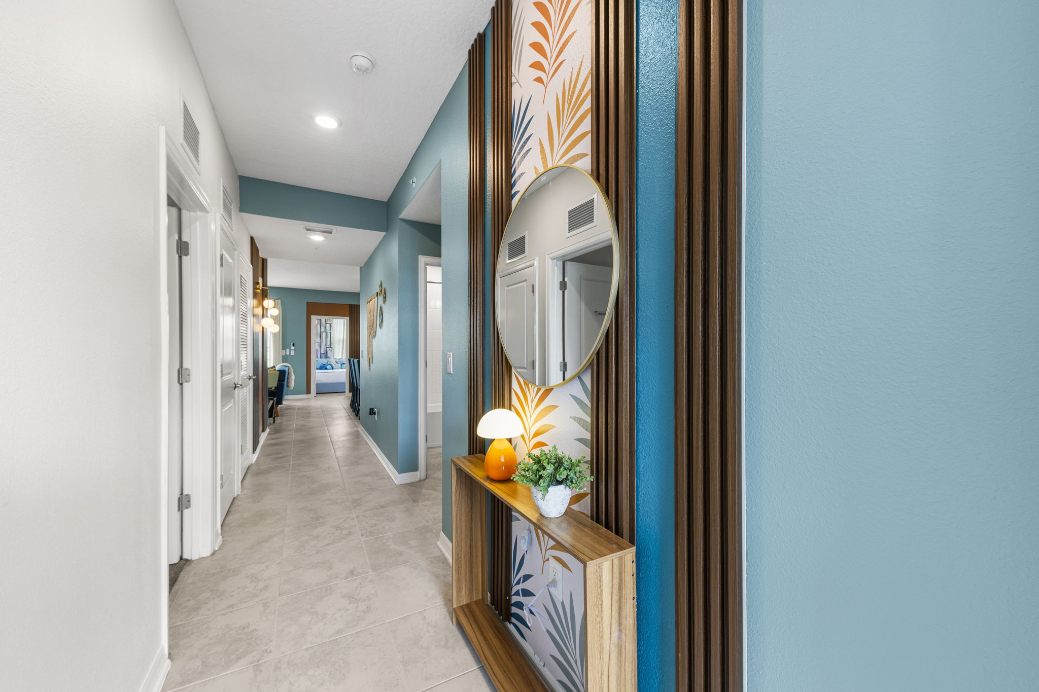 Stylish entry hall with designer accent wall and bright modern finishes