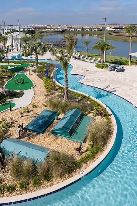Resort-style lazy river, mini golf, and lakefront lounging under the palms