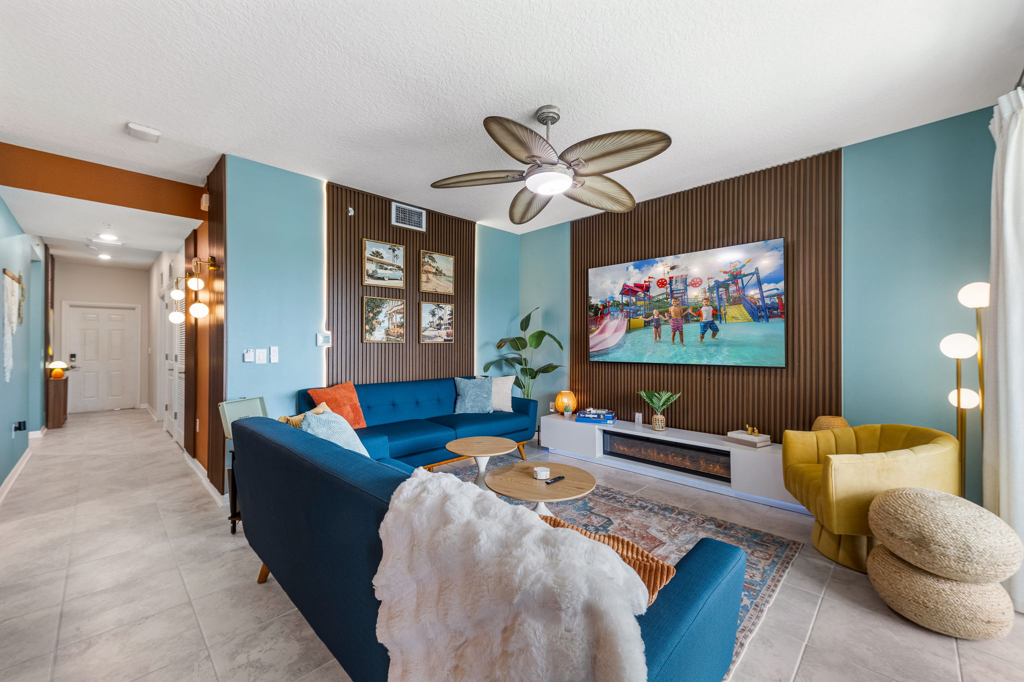 Stylish coastal living room with fireplace, bold decor, and cozy seating
