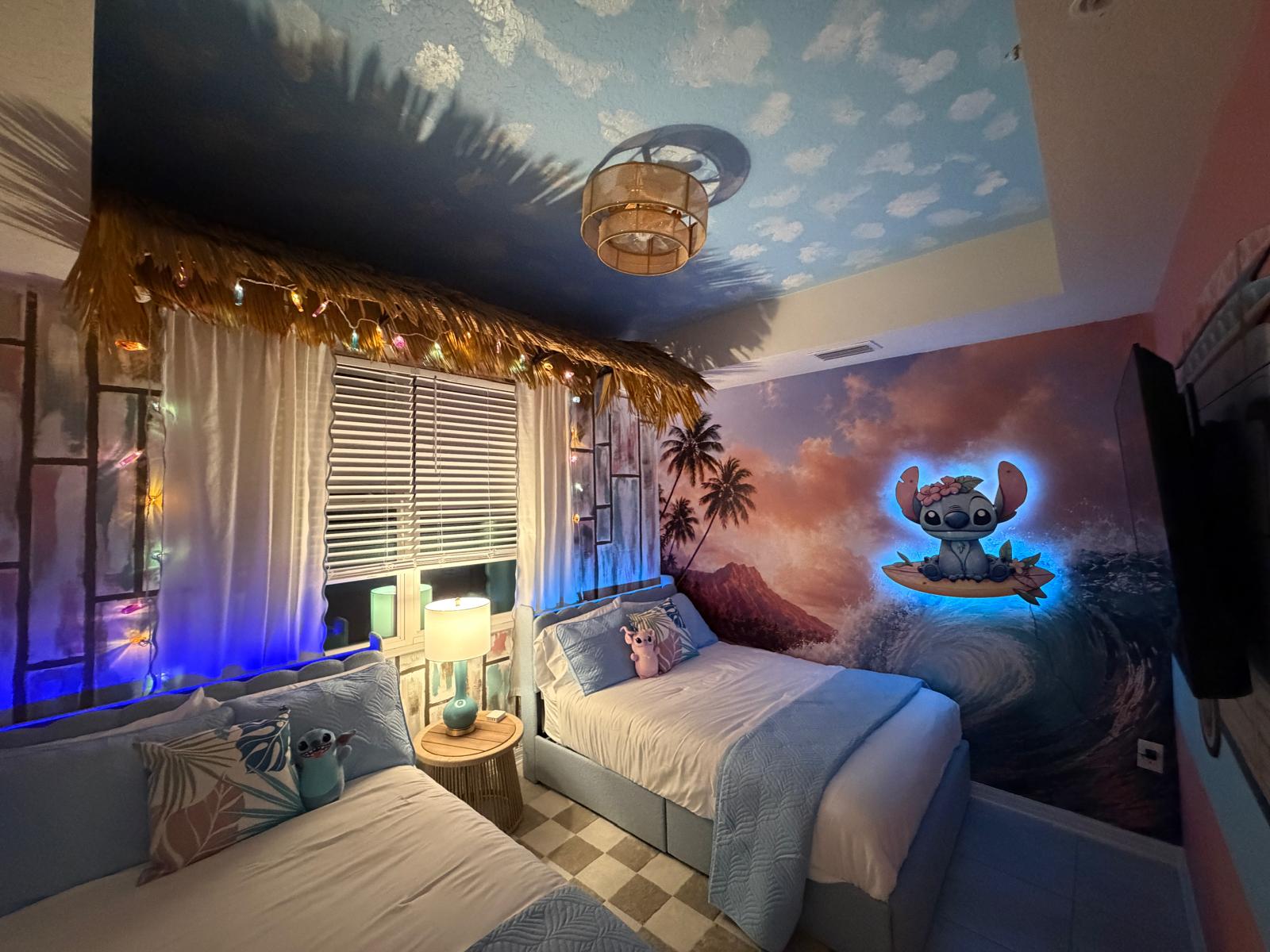 Whimsical tropical twin room with mural art, glowing accents, and cozy charm