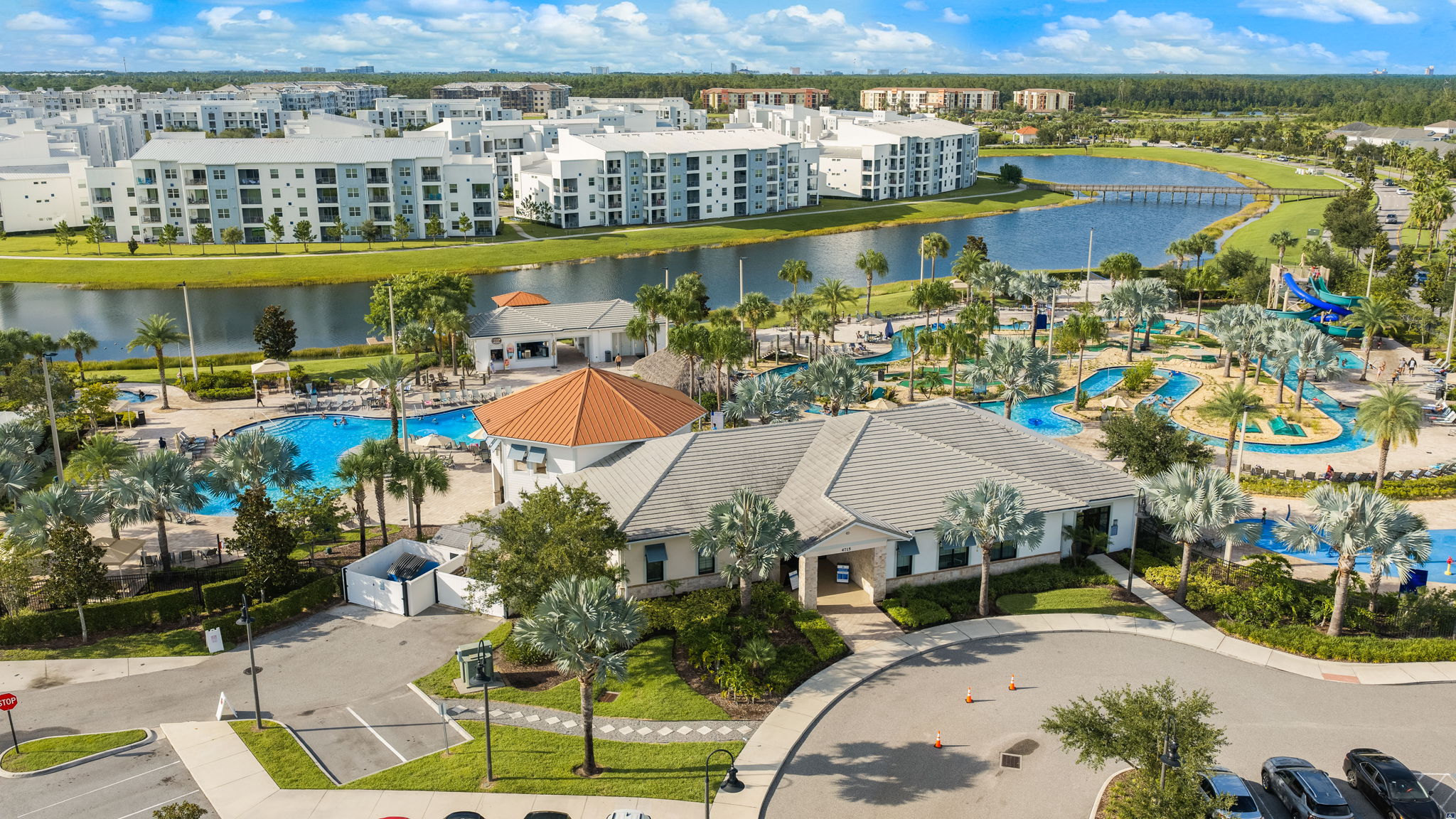 Resort-style pools, palm-lined grounds, and scenic waterfront views