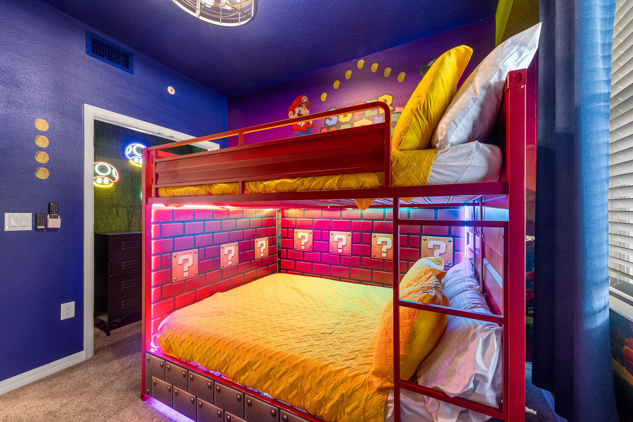 Epic game-themed bunk room with colorful LED lights and family-friendly fun