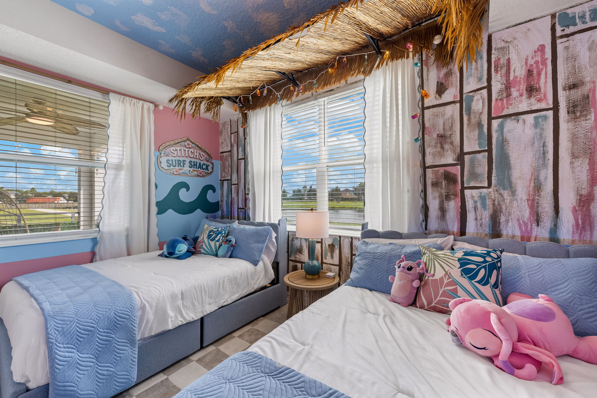 Playful beach-themed twin bedroom with bright coastal charm