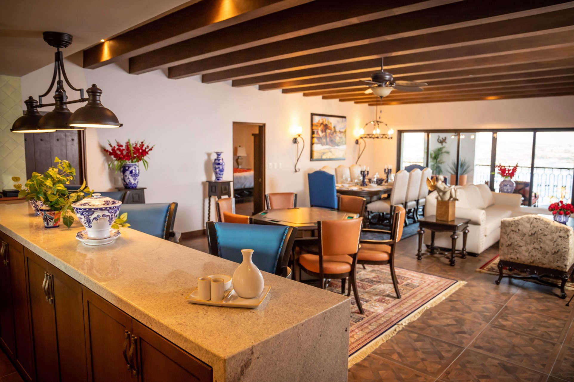 Elegant open living and dining space with beams, light, and room to gather