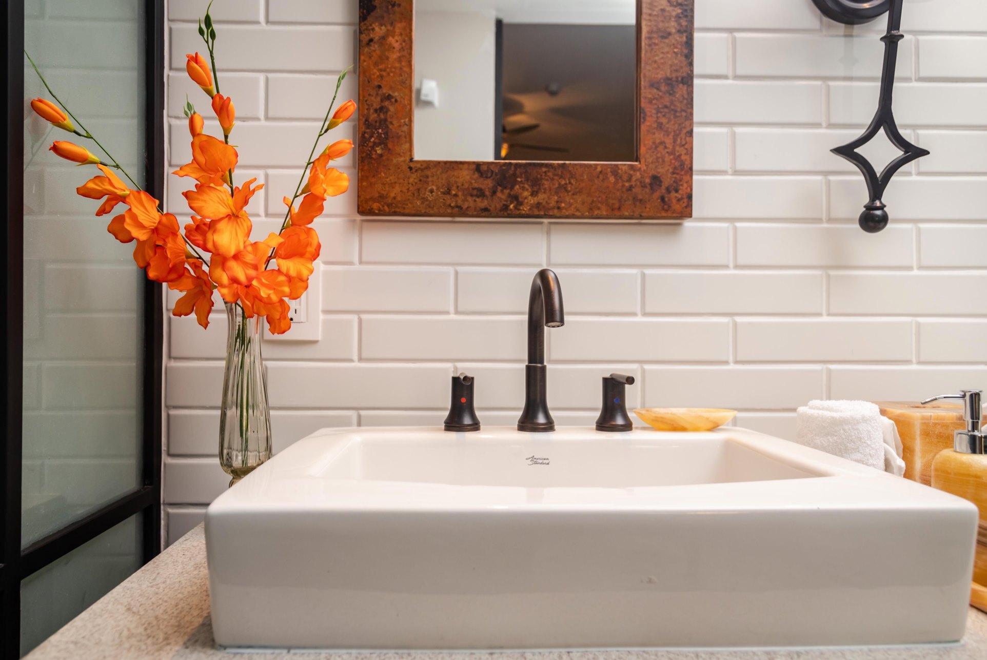 Elegant bathroom vanity with modern sink and bright designer touches