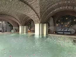 Stunning indoor pool beneath vaulted arches and elegant lounge space