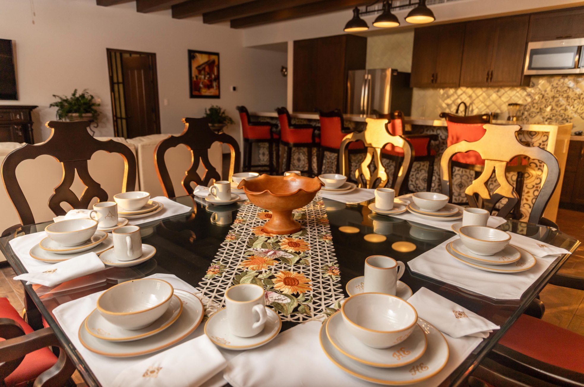 Elegant dining room with large table and stylish kitchen bar seating