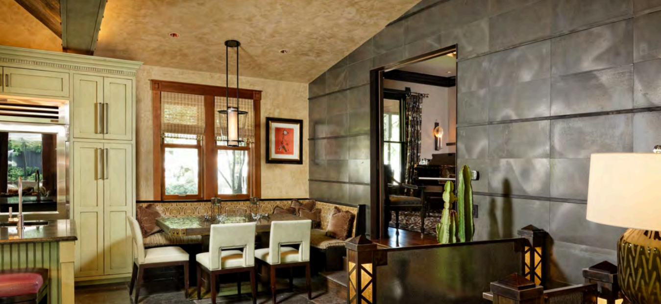 Designer dining nook with banquette seating and warm upscale finishes