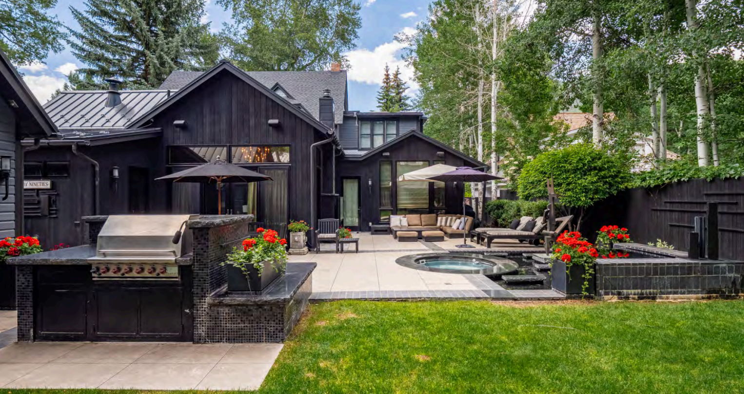 Private backyard oasis with hot tub, grill, and stylish lounge seating