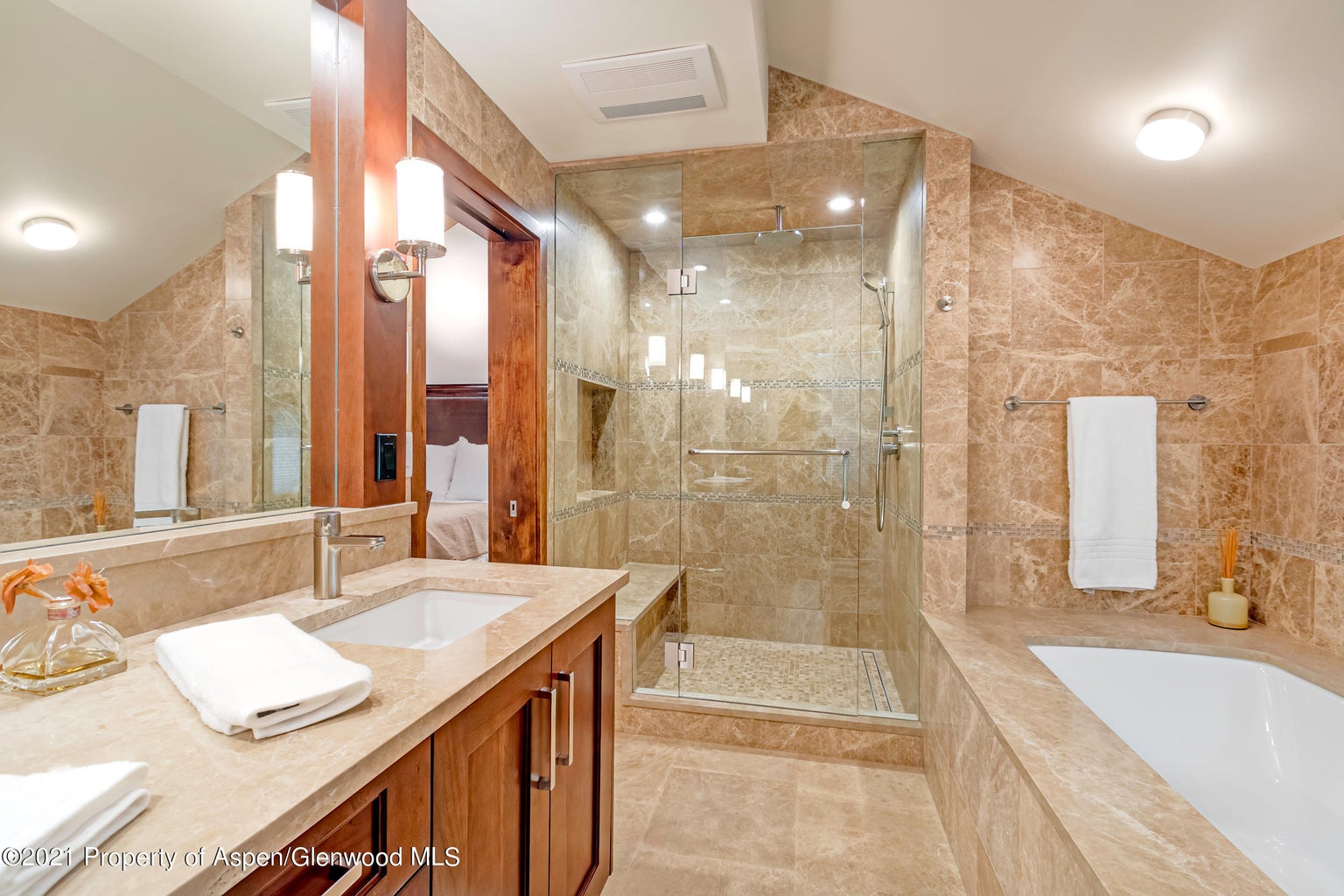 Spa-like bathroom with soaking tub and glass walk-in shower