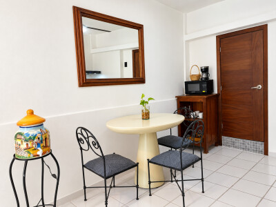 Cozy breakfast nook with coffee station and bright, airy charm
