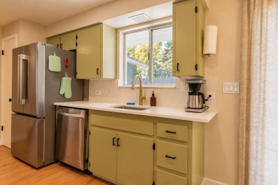 Kitchen with olive cabinets