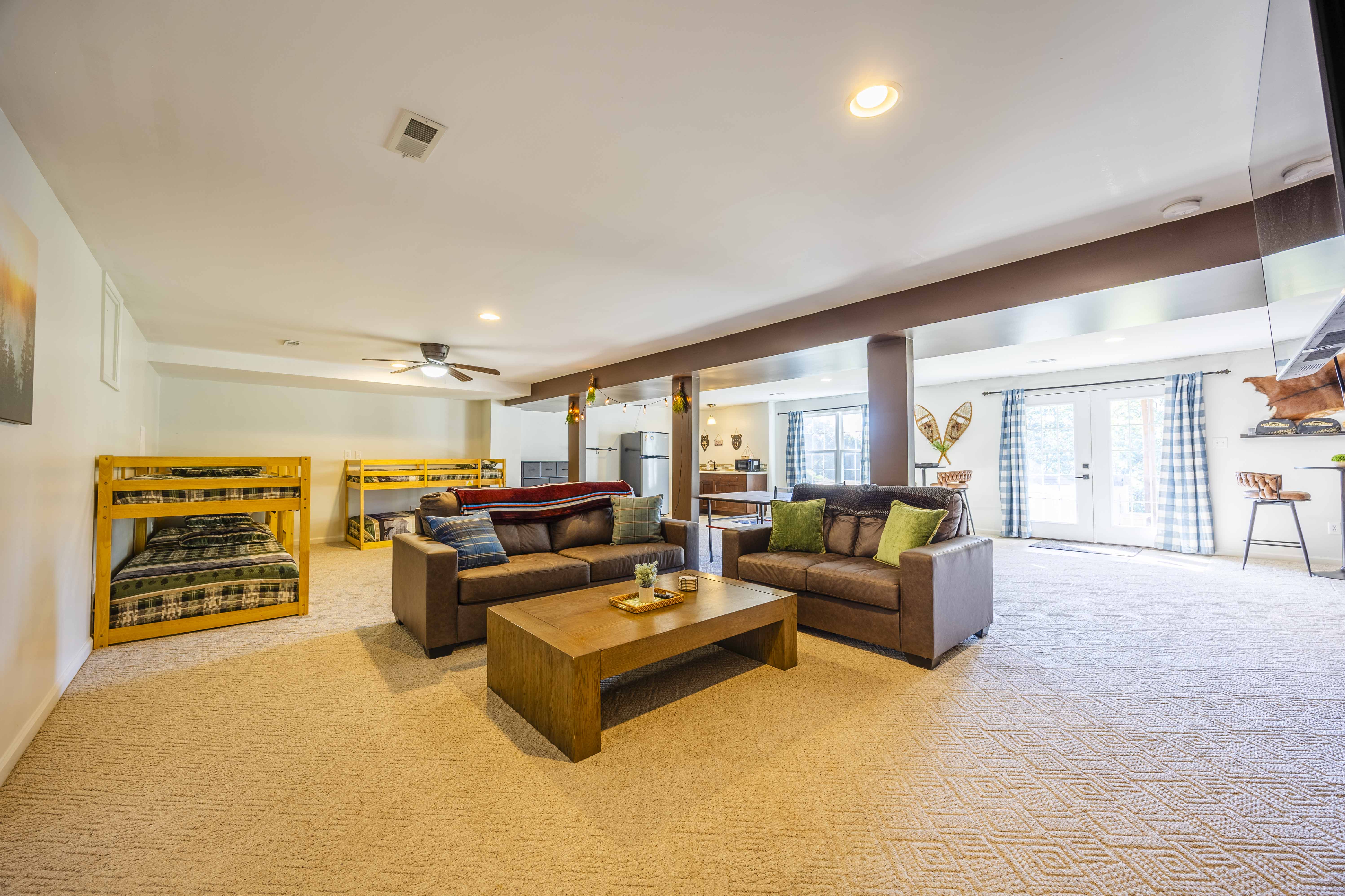 Spacious bunk room lounge with comfy seating and bright open layout