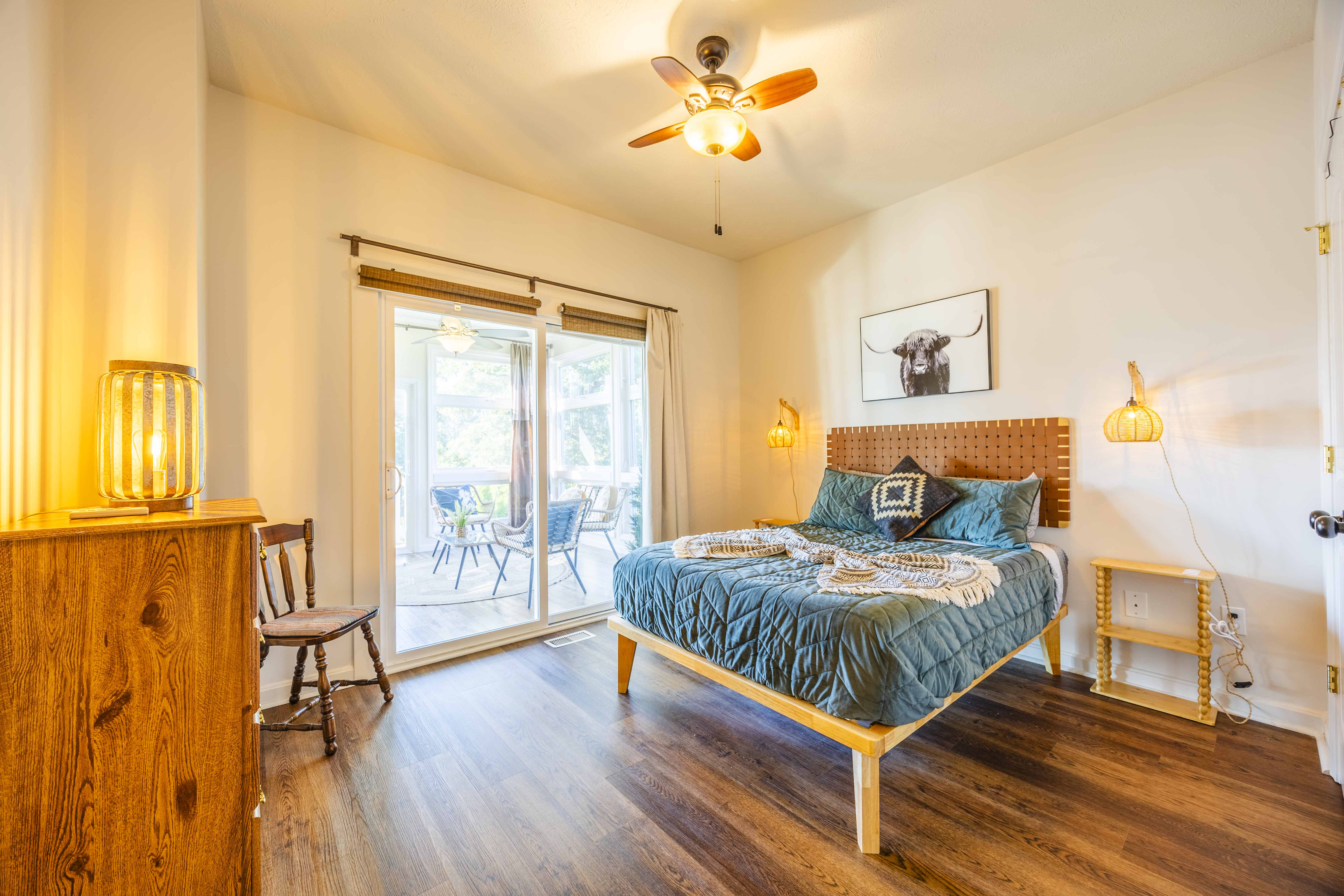Bright king bedroom with patio access and warm, modern touches
