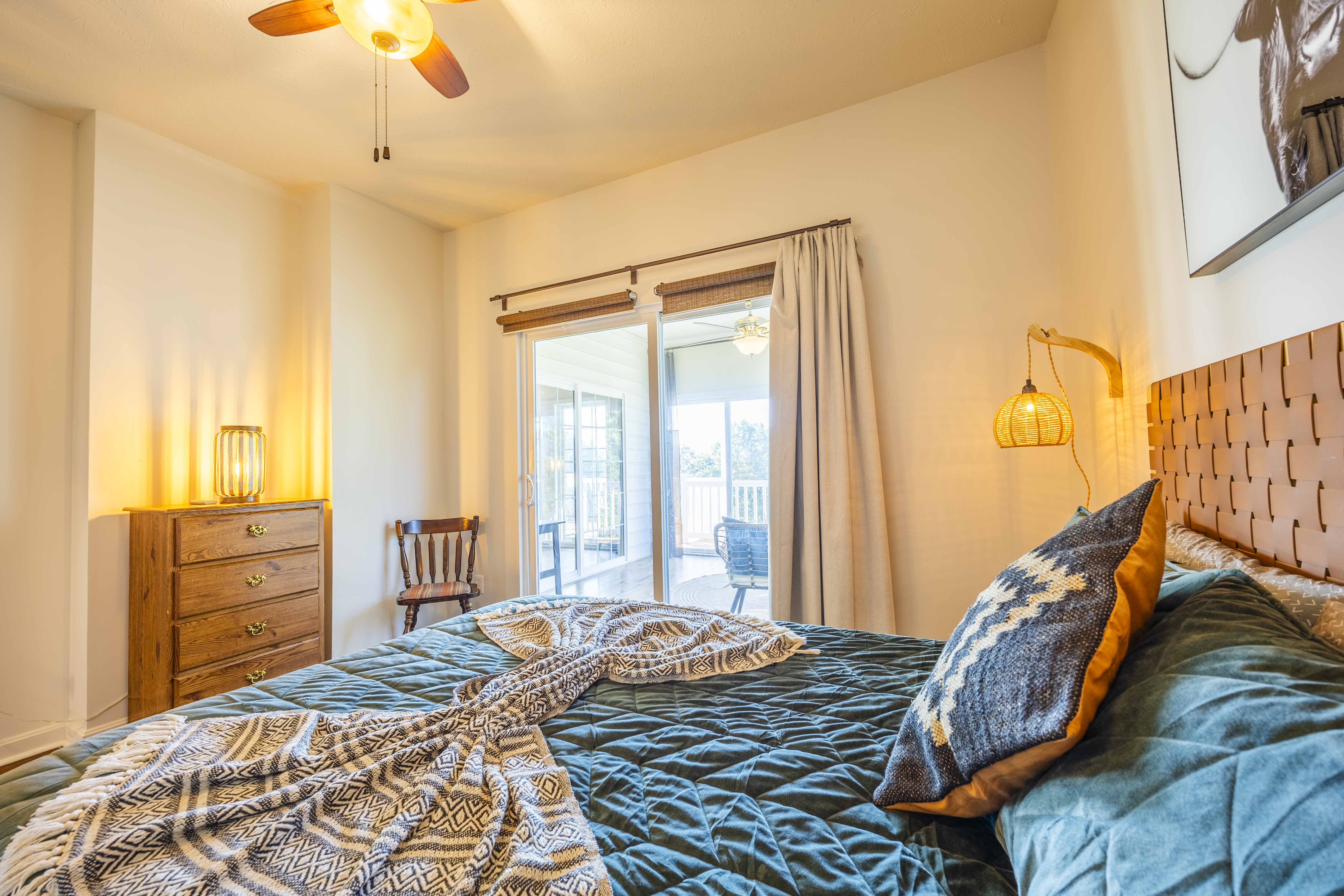 Cozy bedroom with warm lighting and private balcony access