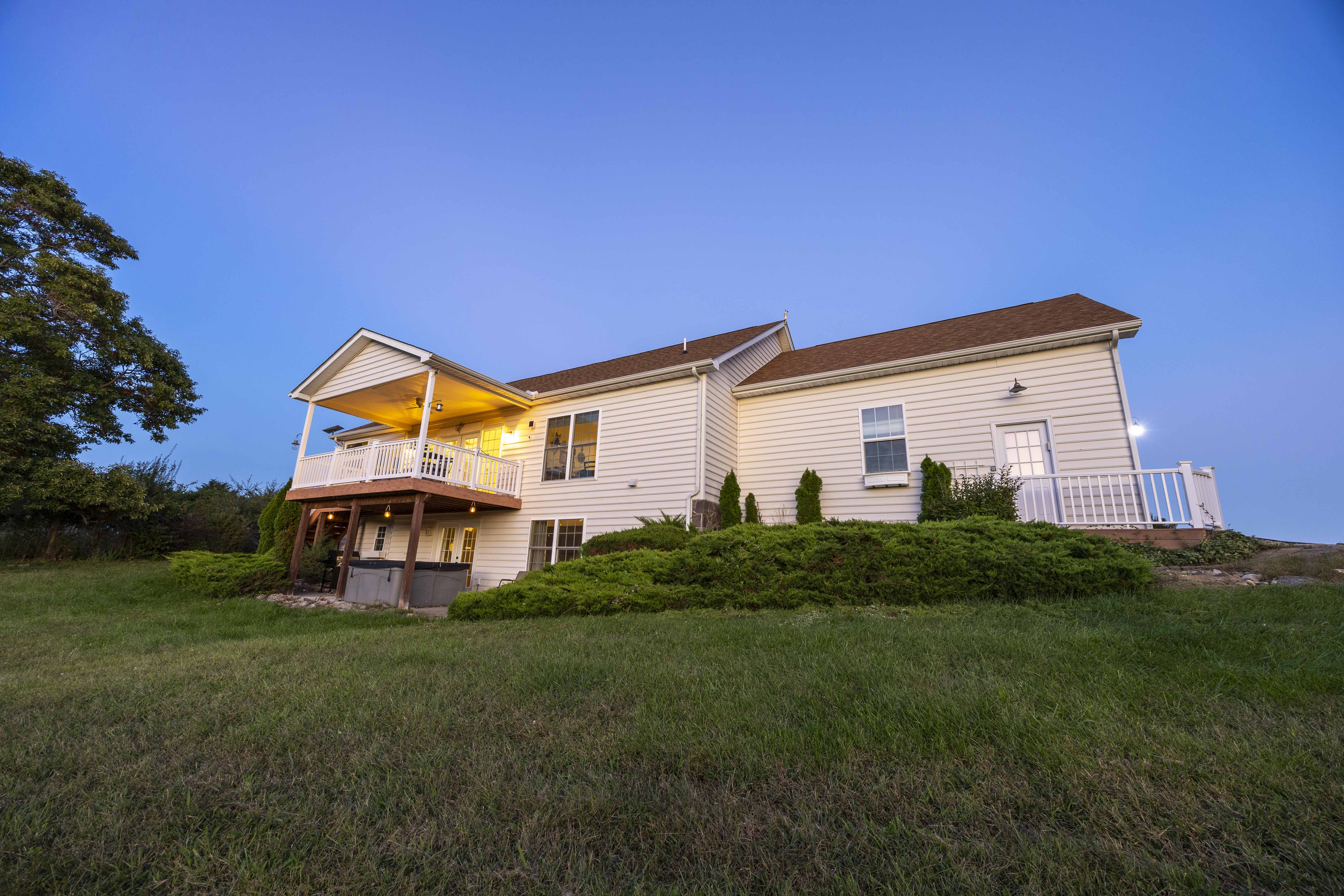 Spacious hillside home with covered deck and peaceful sunset views