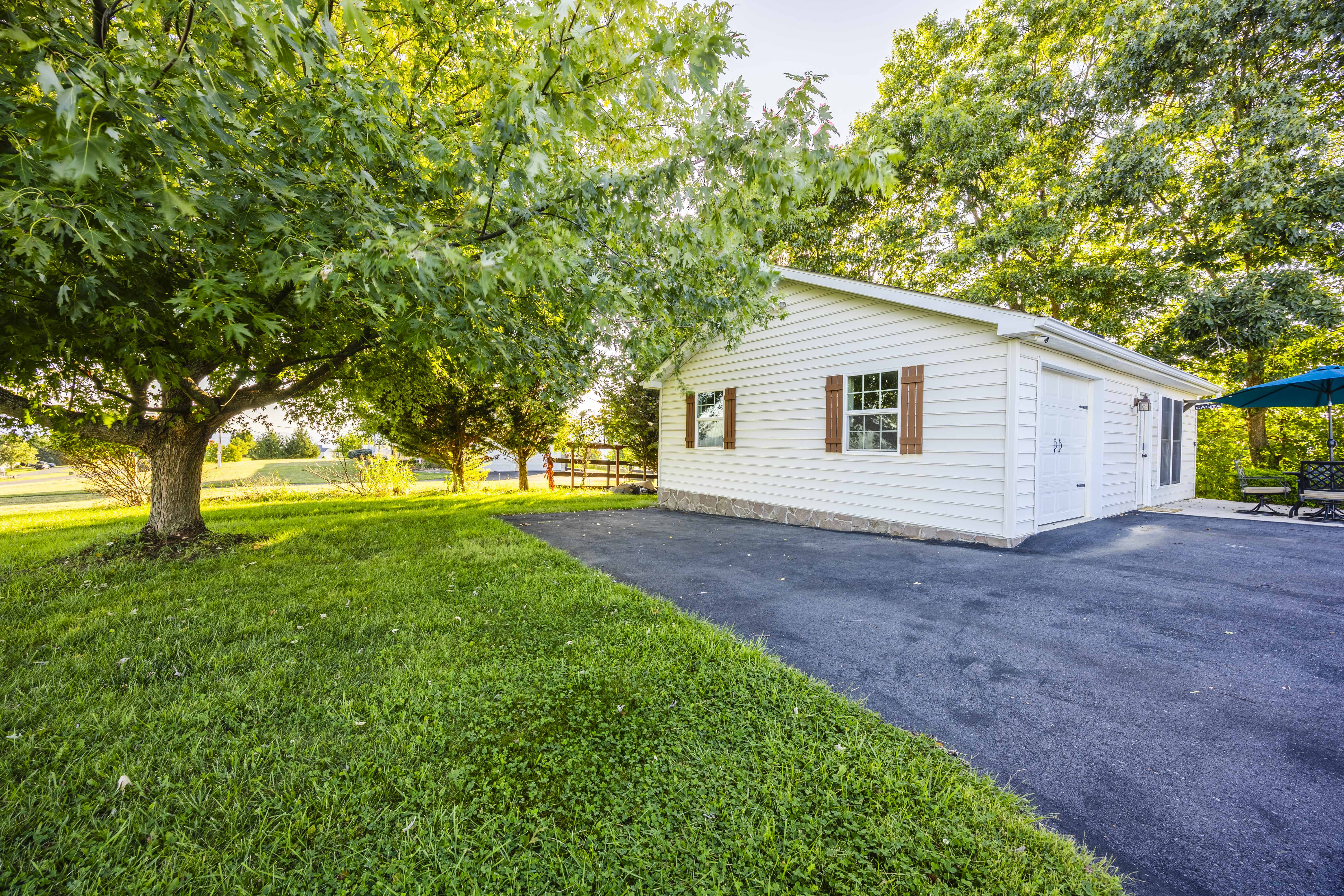 Peaceful cottage with shady yard, private drive, and relaxing outdoor space