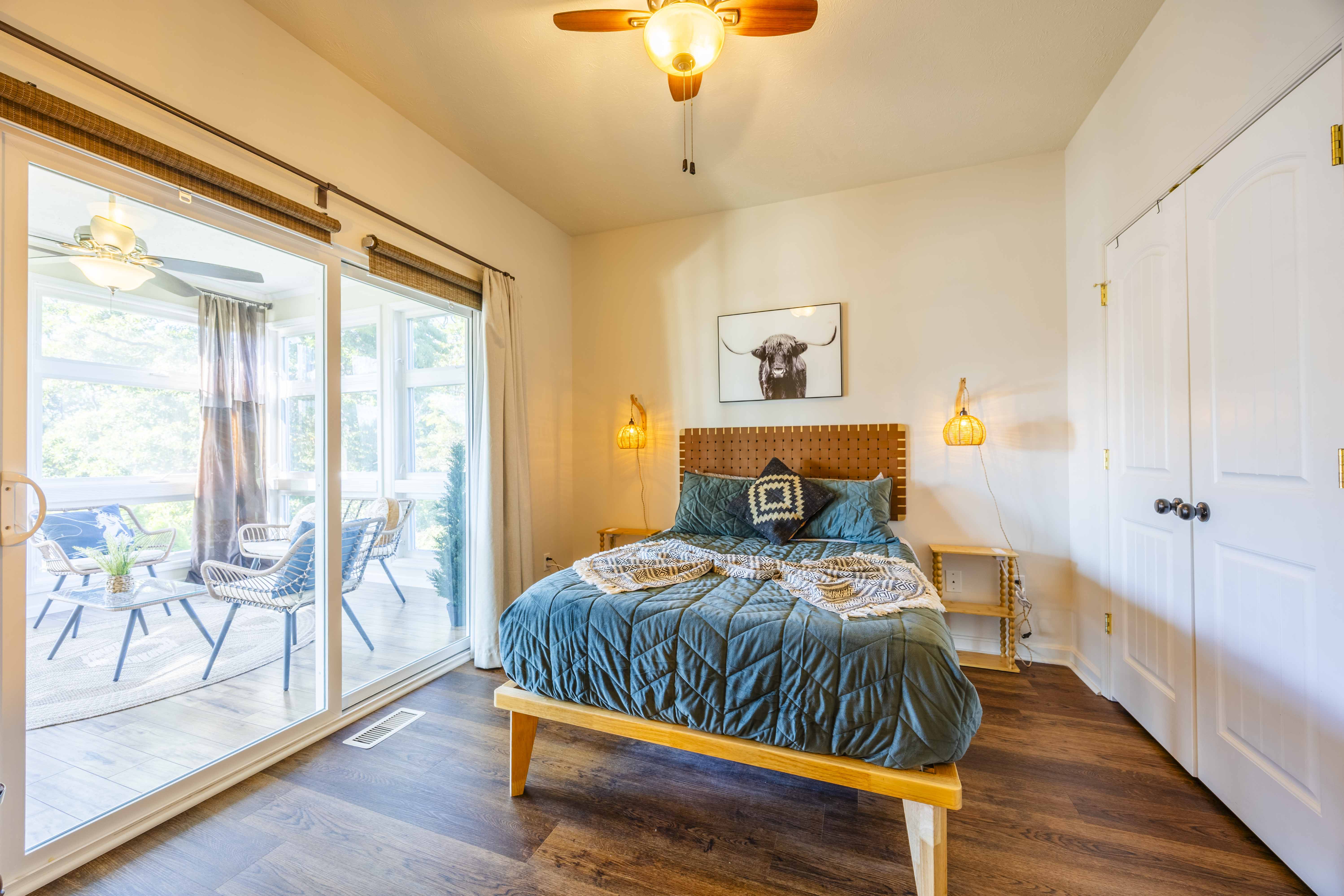 Bright bedroom with patio access, natural light, and cozy modern style