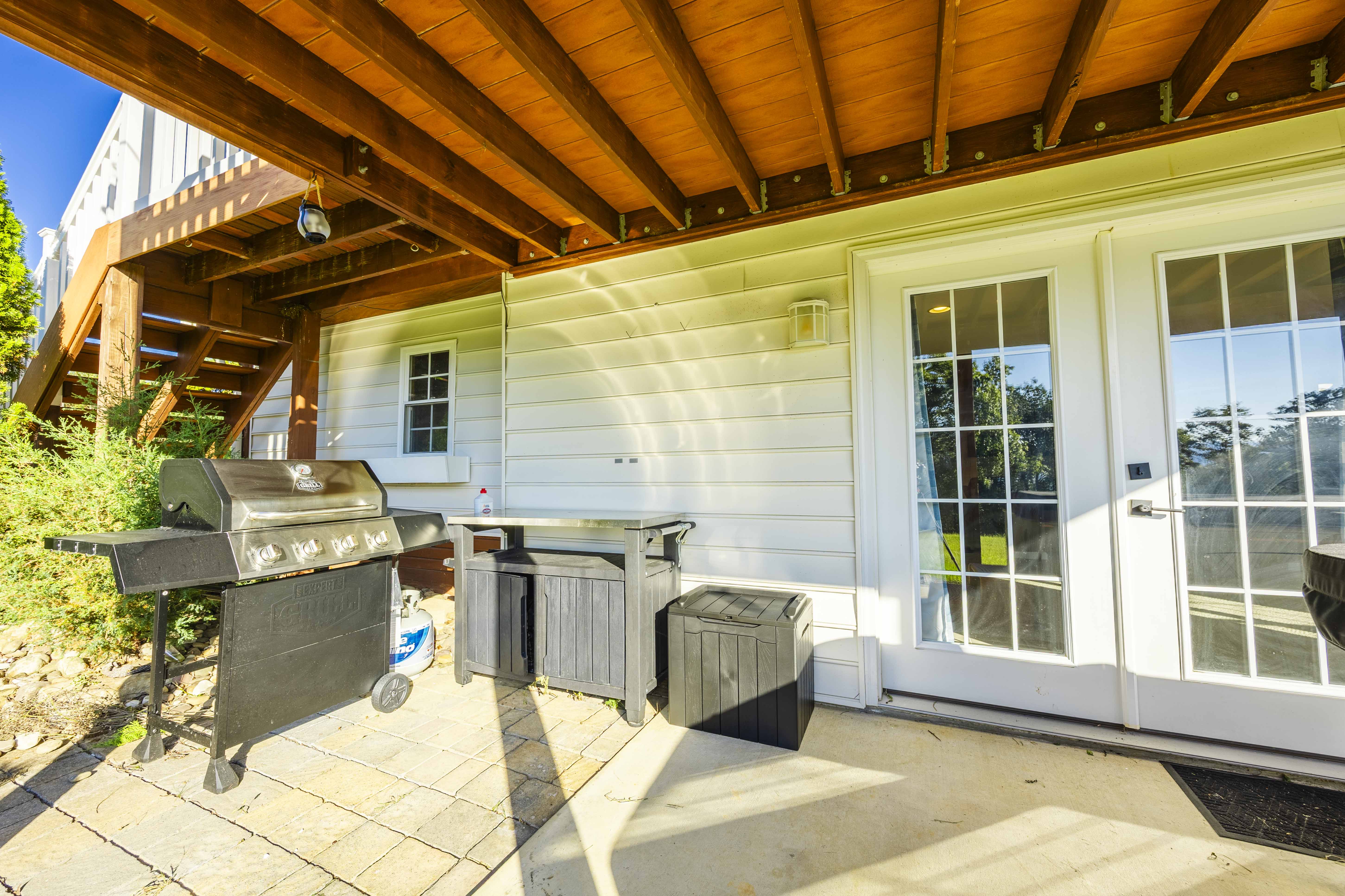 Covered patio with gas grill and French doors for easy indoor-outdoor living