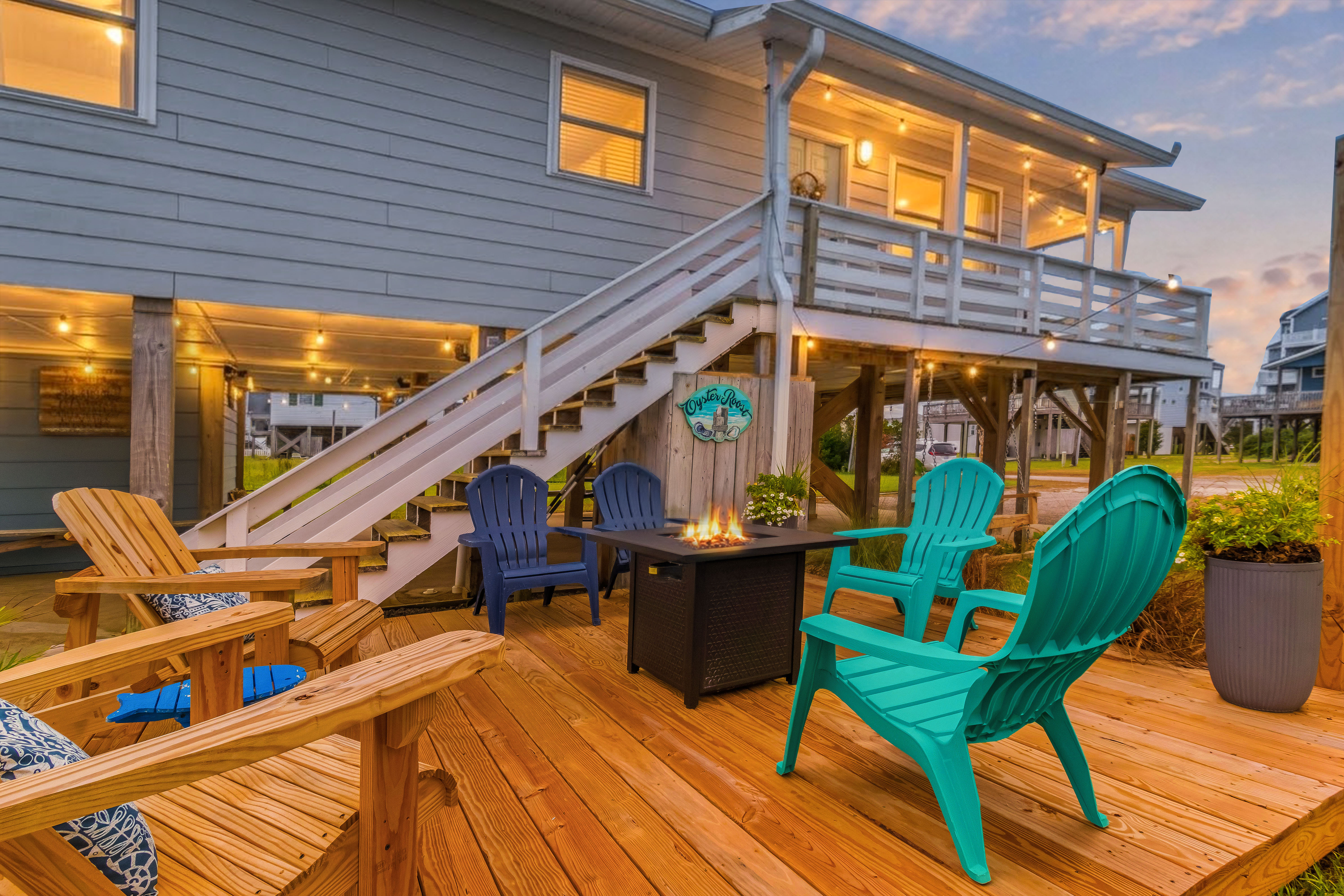 Relax on the spacious deck with Adirondack chairs and a cozy fire table
