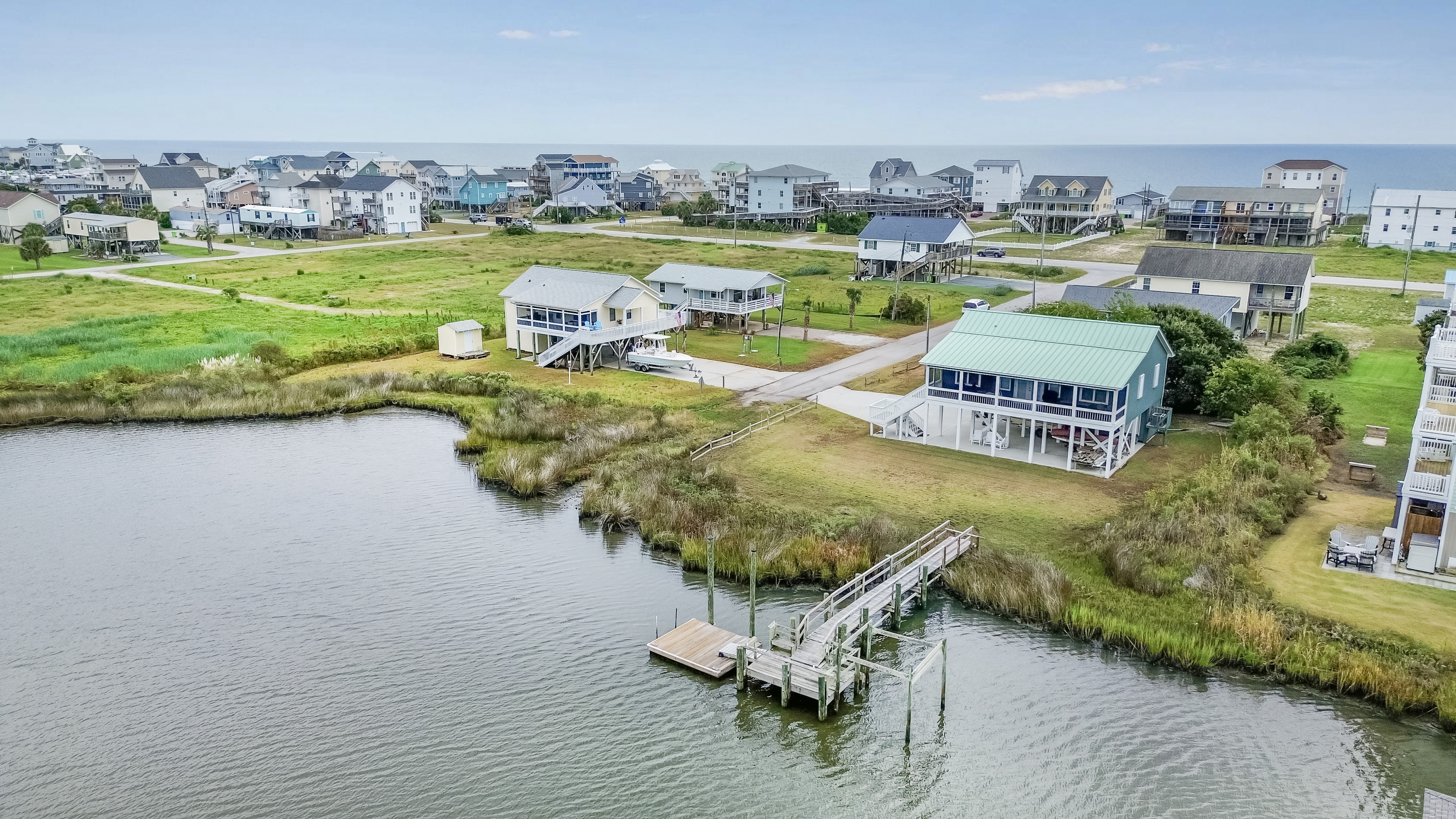 Waterfront coastal home with private dock and ocean nearby