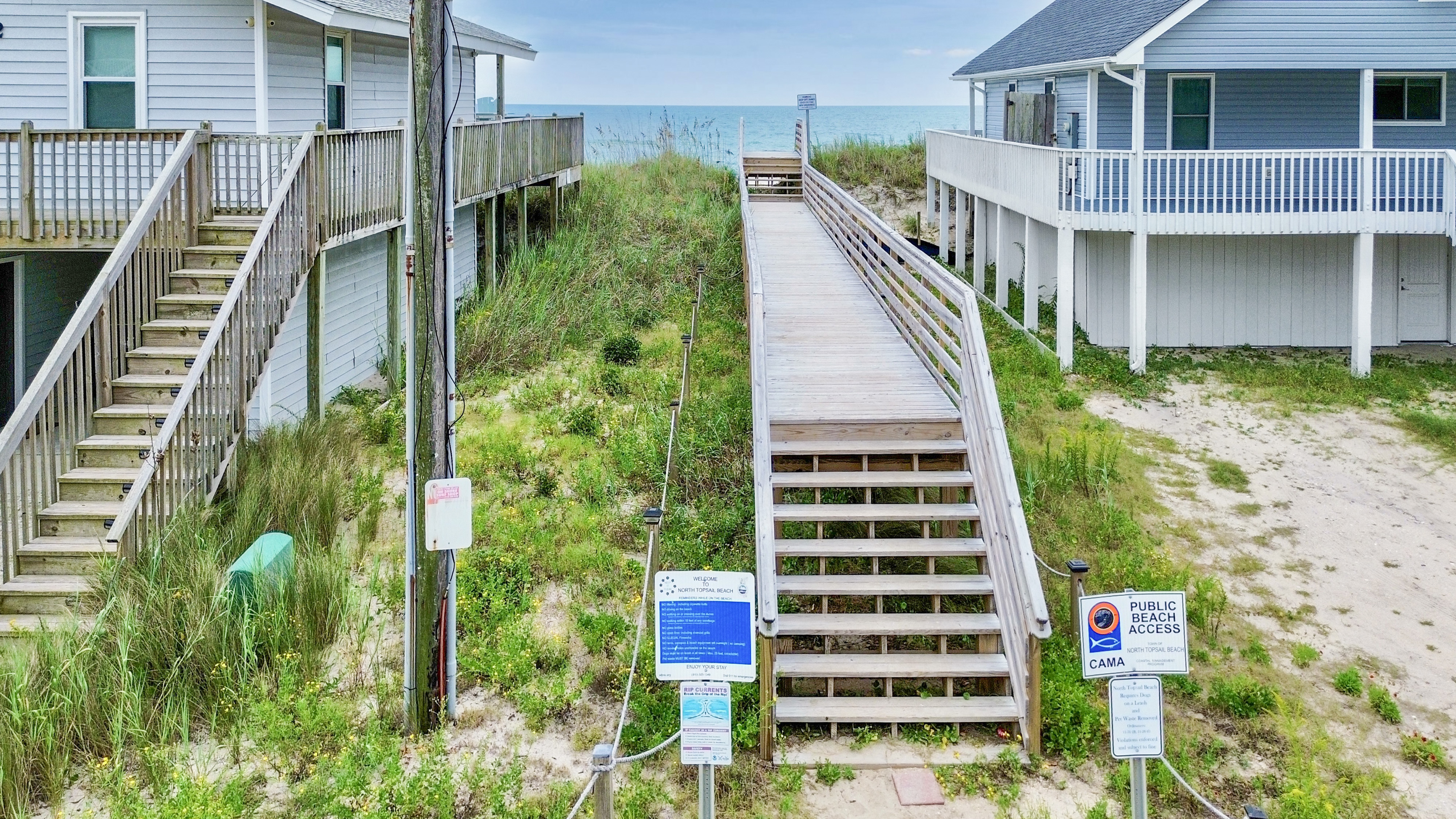 Direct beach access boardwalk between the homes to the ocean