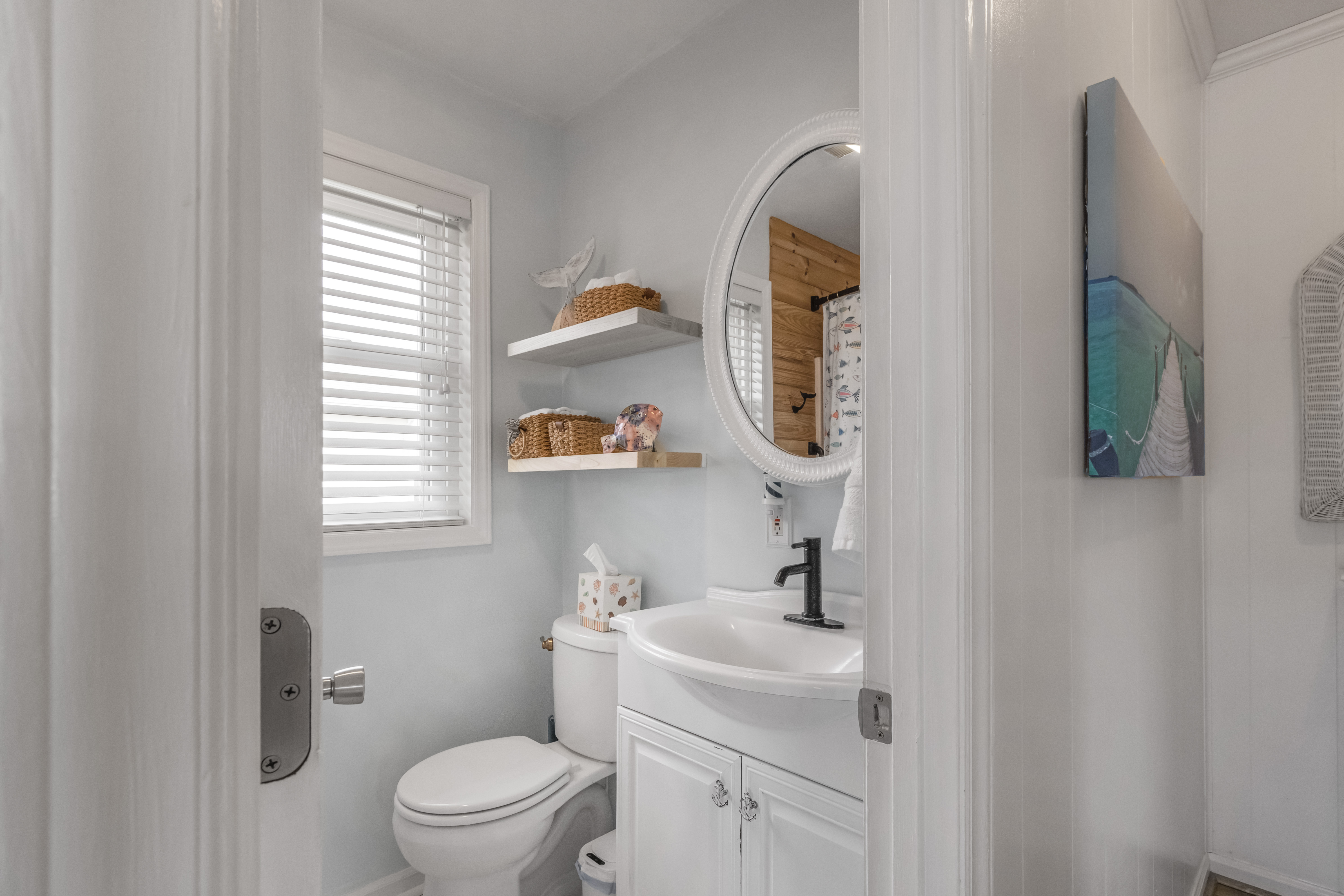 Bright coastal bathroom with natural light and stylish modern touches