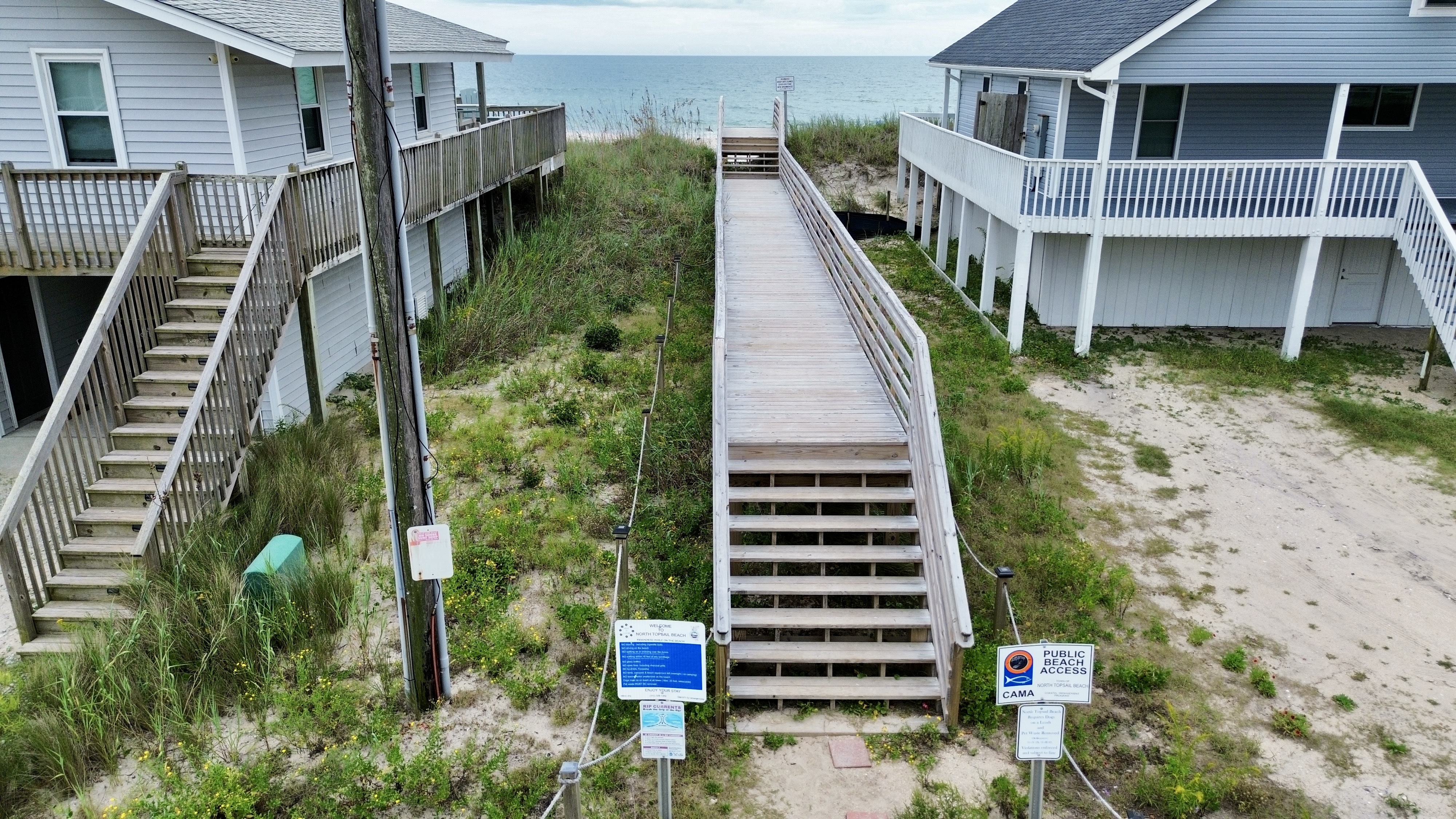 Direct beach boardwalk access between charming coastal homes