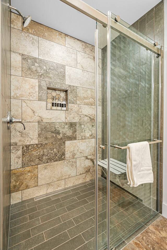 Lake George Suite's bathroom has a curbless walk-in shower and a seat which can be folded up when not in use (great for balancing leg on when shaving!).  Eucalyptus scented shampoo, conditioner, and body wash are provided.  Unscented available.
