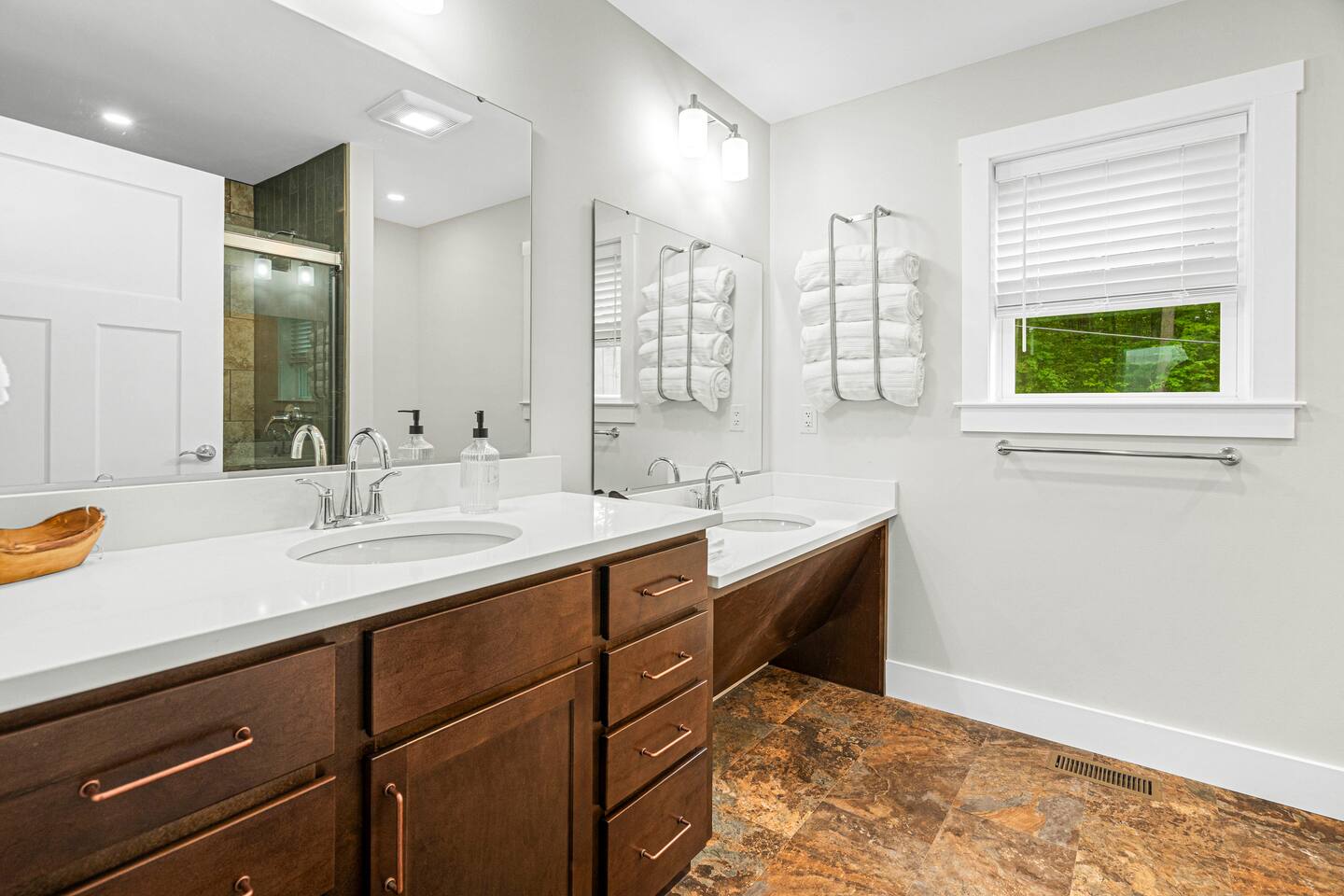 The attached Lake George bathroom has two sinks, with one sink lowered to allow for a seat - which makes putting on makeup and doing your hair so much easier!  Towels are luxuriously oversized bath sheets, and hair dryer is in the top drawer