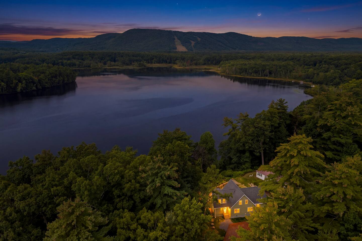 Evening view from above Hudson River Lodge, showing the bend in the Hudson and nearby West Mountain