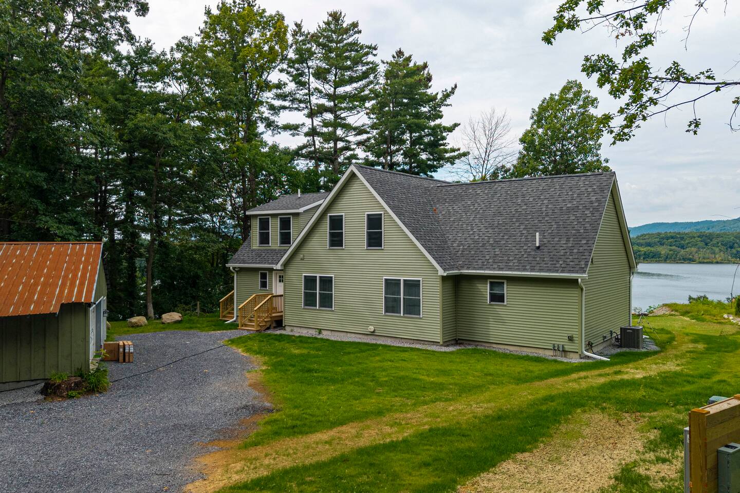 As you drive up to the house, the view will be peeking through on the side. Both solar lighting and motion-sensing lighting will help guide you to the keyless entry door.