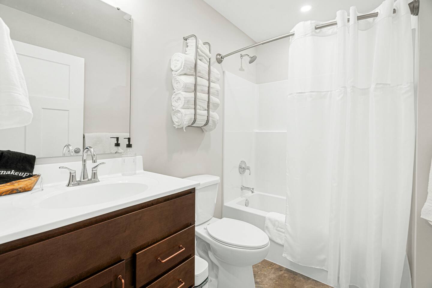 The downstairs bath shared by the Hudson and West Mountain Rooms has a tub/shower combination.  Towels are luxurious bath sheet sized. Hairdryer provided. Eucalyptus-scented shampoo, conditioner, and body wash are provided.  Unscented is available.