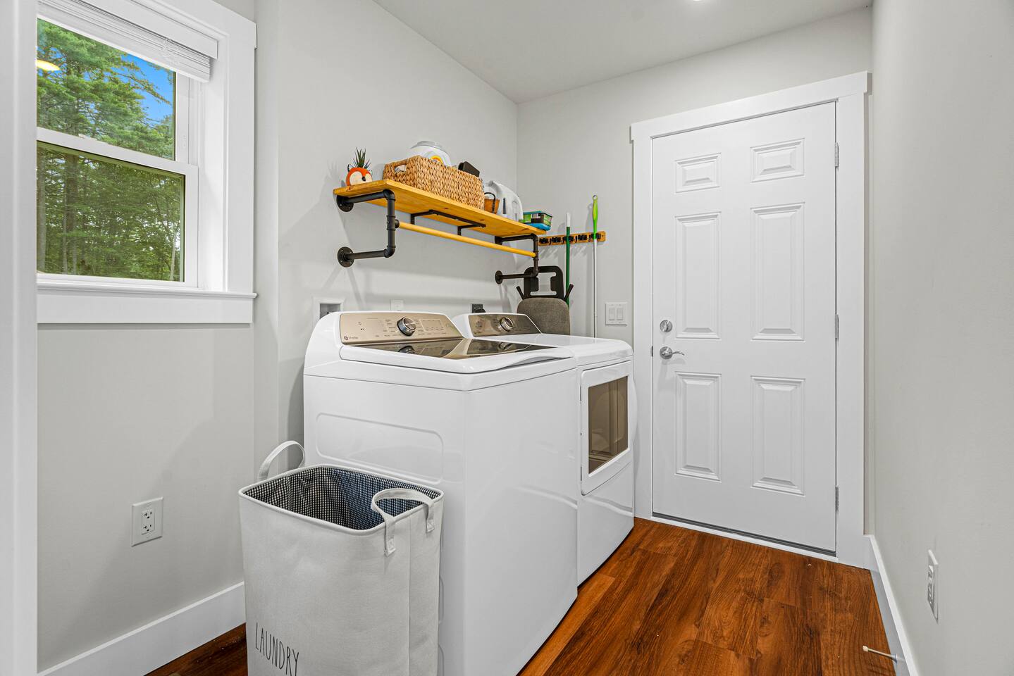 The mudroom is right by the side entry, and comes stocked for you to use with scent-free detergent, dryer sheets, a steamer, and an iron and ironing board.  Kick off your ski or boating gear in here!