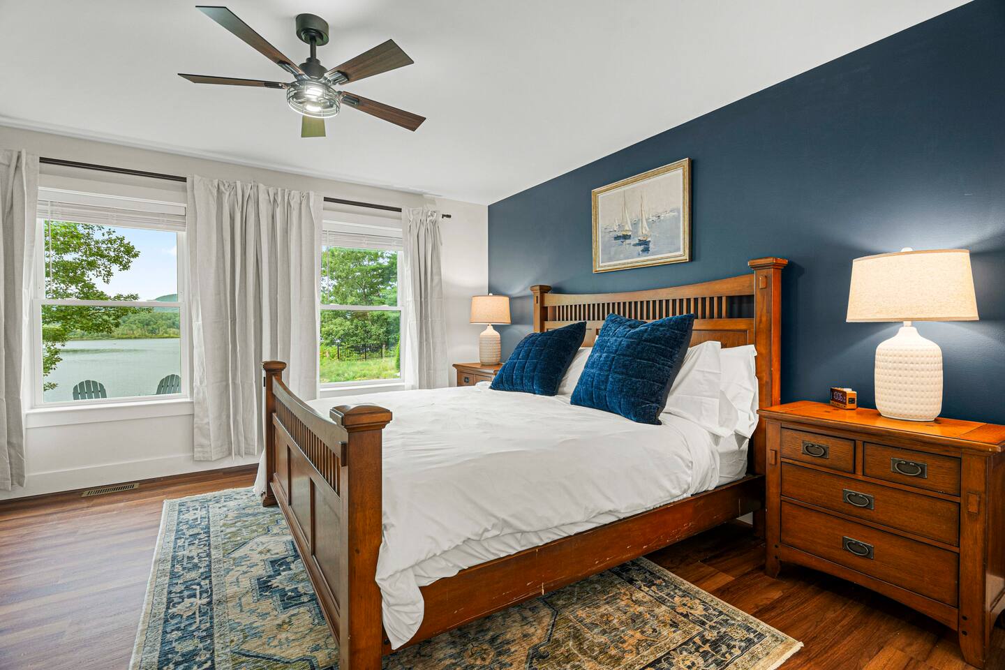 The Lake George Suite, the downstairs primary, has a dedicated work space and TV - not pictured, because the view is so much more enjoyable!  This room has a walk-in closet with a matching dresser.