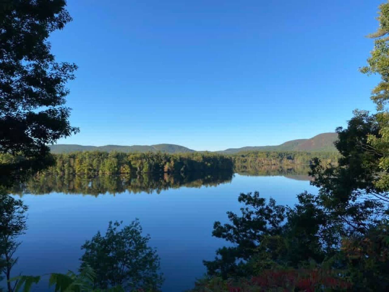 When the Hudson is still, it can look like a mirror.  This is another view from the backyard, showing the bend of the Hudson with West Mountain to the right