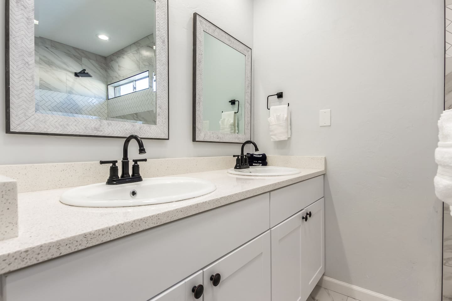 En-suite bathroom of the primary bedroom with elegant double-sink vanity and ample counter space—ideal for getting ready with ease.