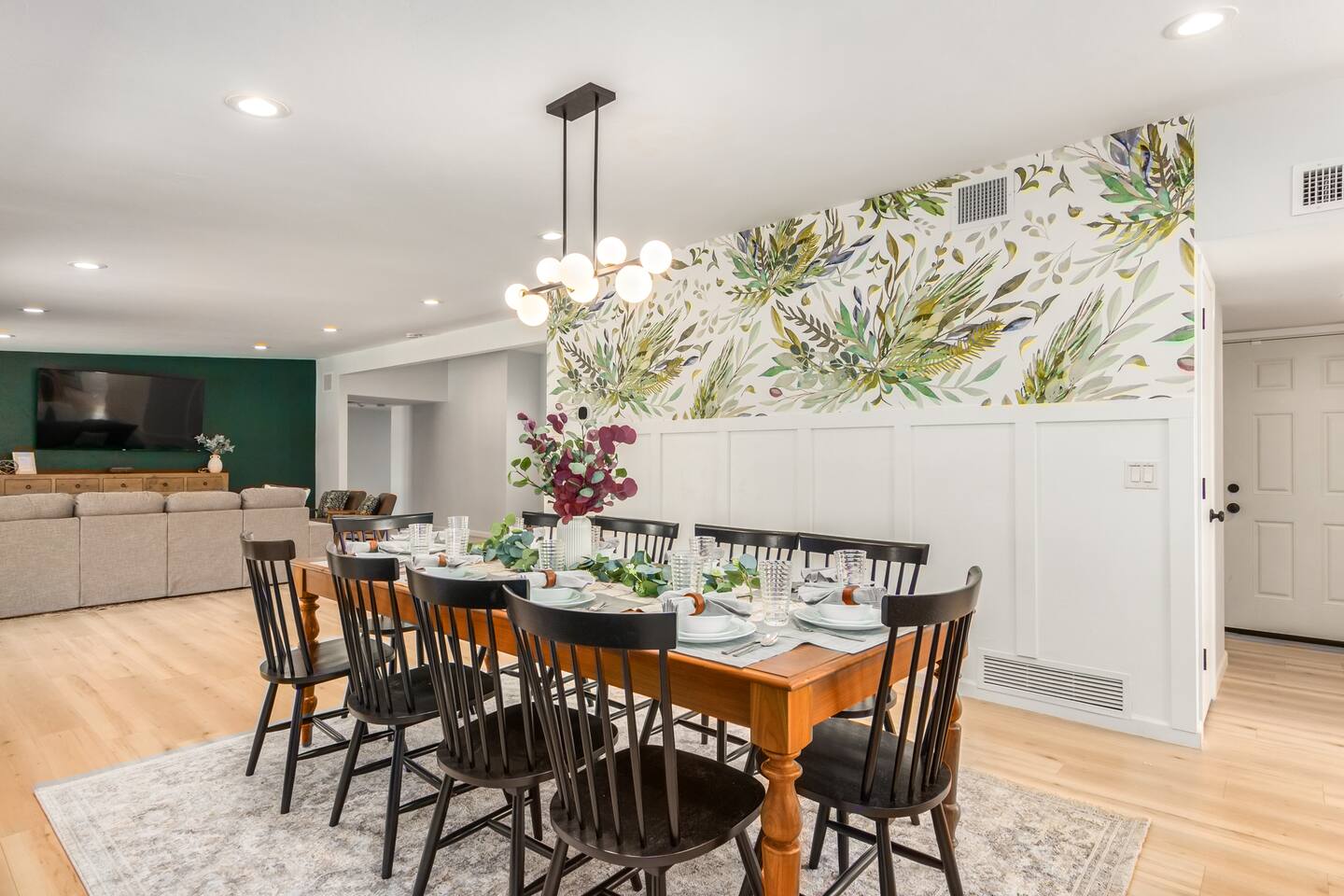 Enjoy memorable moments around the spacious dining table, surrounded by stylish décor and a beautiful accent wall—ideal for family dinners or game night fun.