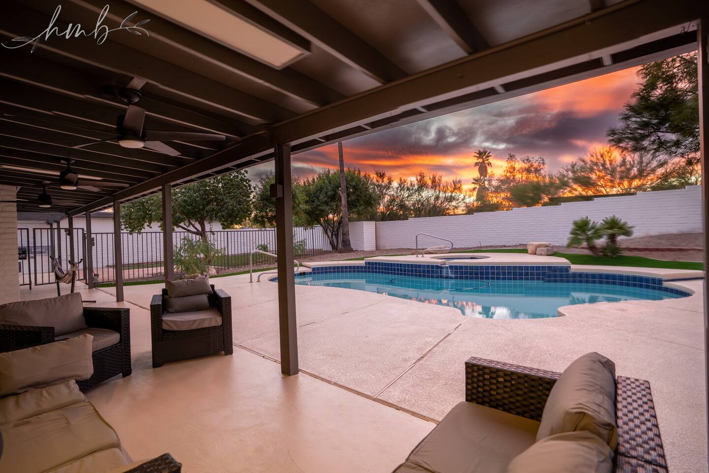 Relax by the sparkling pool or unwind under the covered back patio with comfortable seating—perfect for lounging, socializing, and enjoying the outdoors.