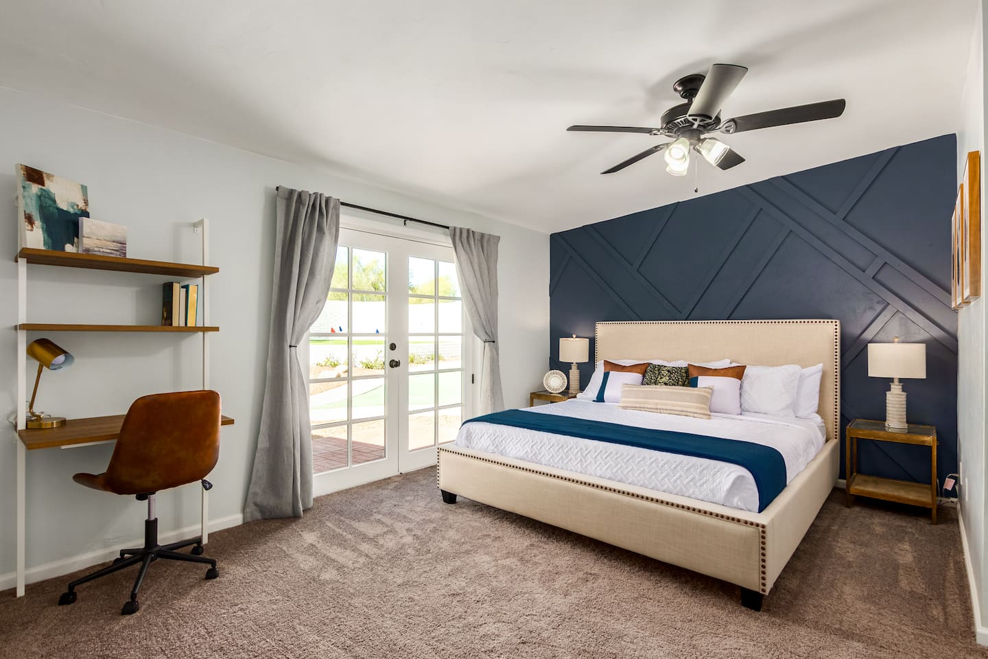 Primary suite with walk-in closet, en-suite bathroom, desk, and private backyard access—your own peaceful retreat.