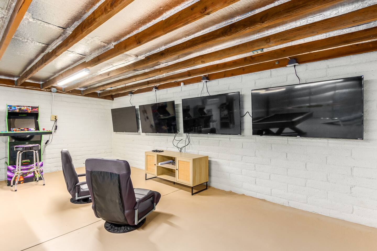 Four 55" TVs make this space a gamer's dream—bring your own console and dive into epic multiplayer sessions.