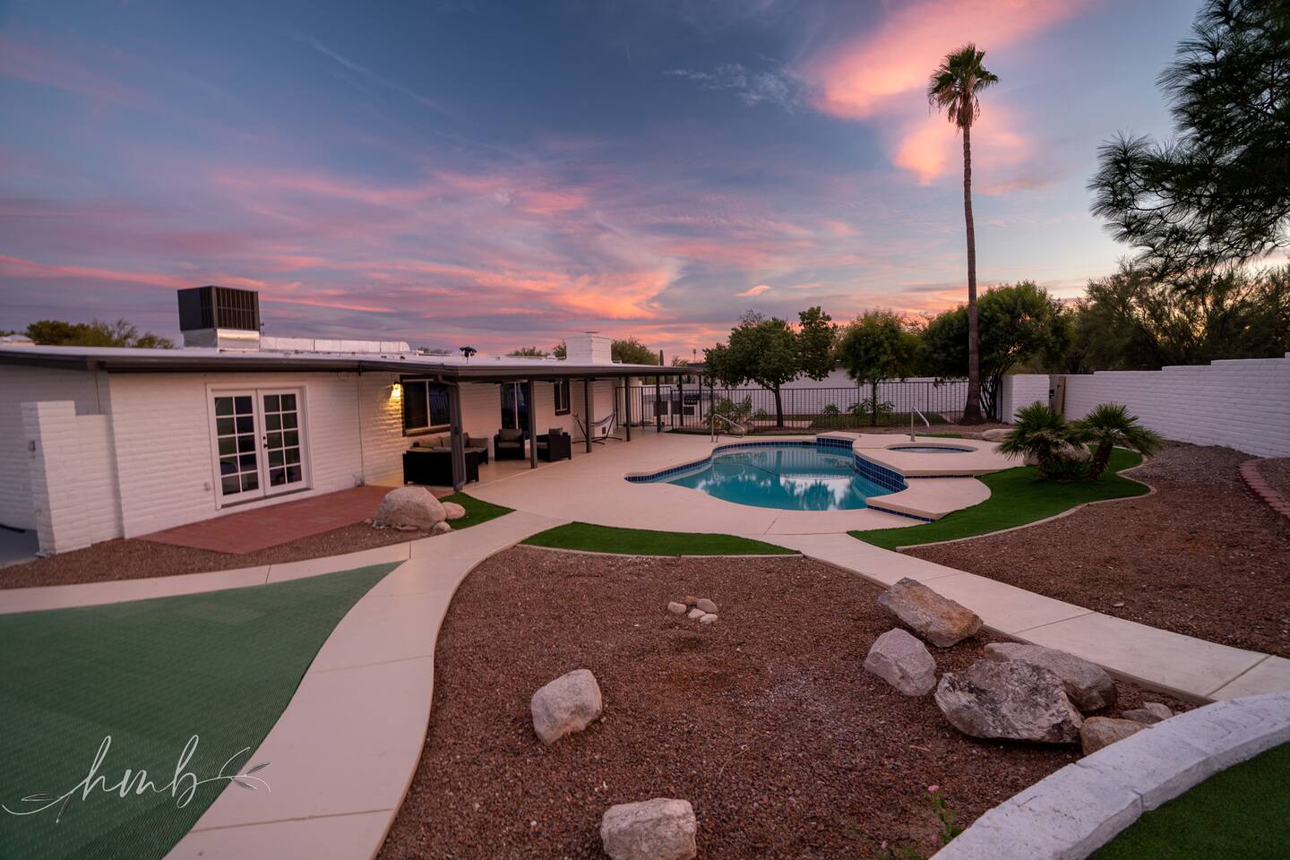 Lounge by the pool or soak in the hot tub, then relax on the covered patio with comfortable seating—perfect for enjoying sunny days or laid-back evenings.