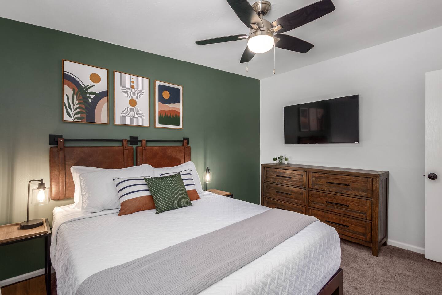 Unwind in comfort with a 55" TV and cozy queen bed in this beautifully designed room that blends comfort and modern style.