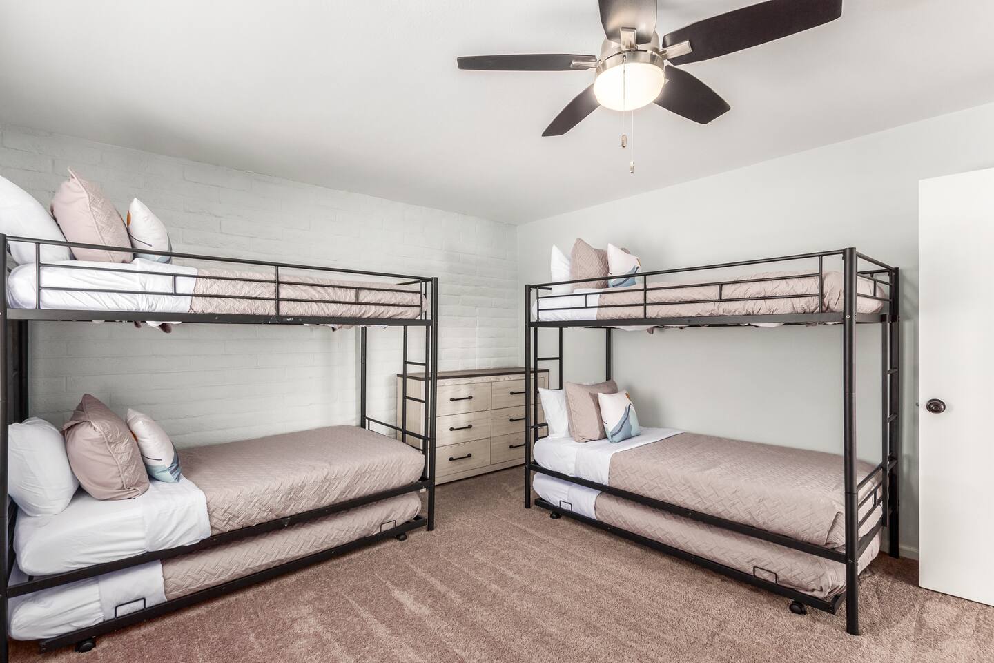Bunk Room: Perfect for kids or a group of little adventurers, this room features 2 twin bunk beds with 2 trundle beds, sleeping up to 6. A dresser keeps things organized, and a 55" TV provides entertainment for movie nights or gaming.