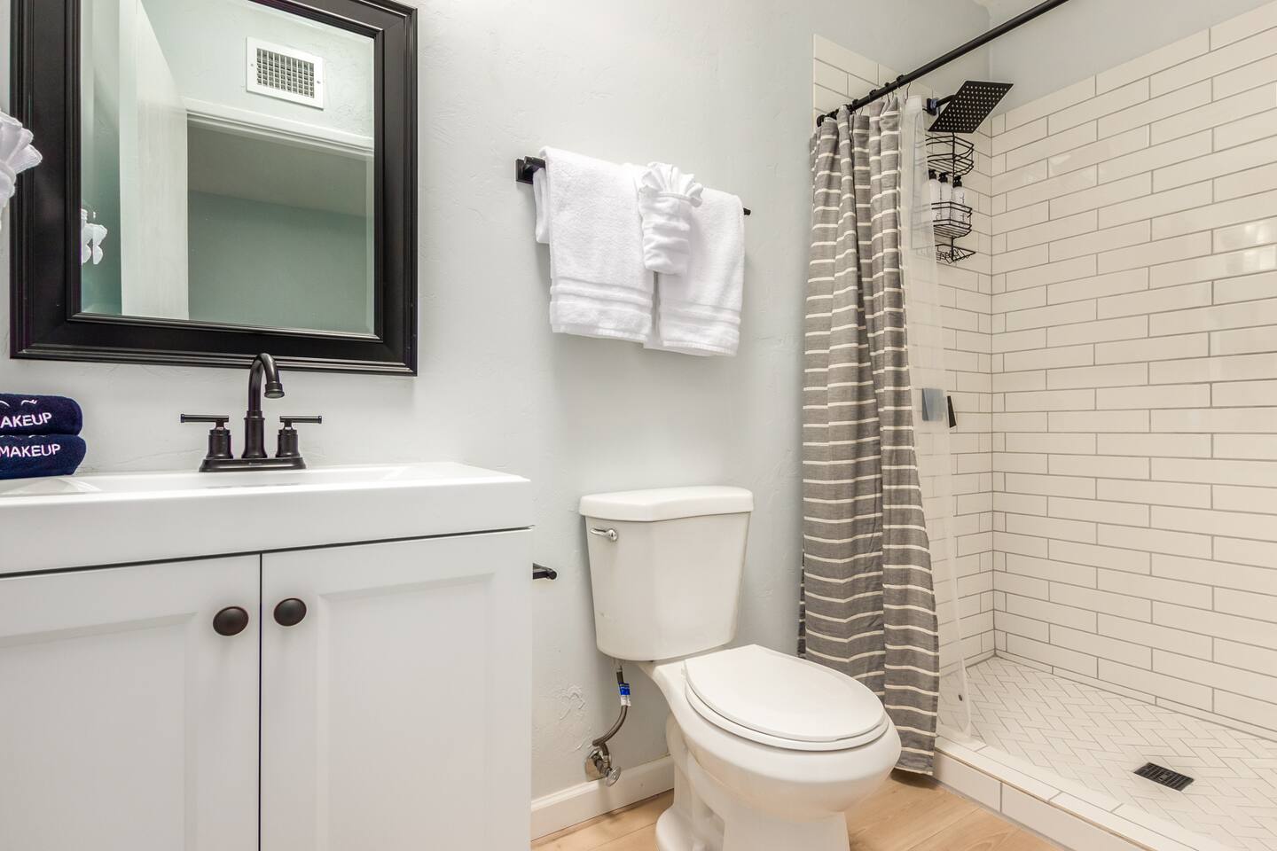 Refresh and unwind in this beautifully designed bathroom featuring a sleek single-sink vanity and a spacious tile shower—an inviting retreat to start or end your day in comfort.