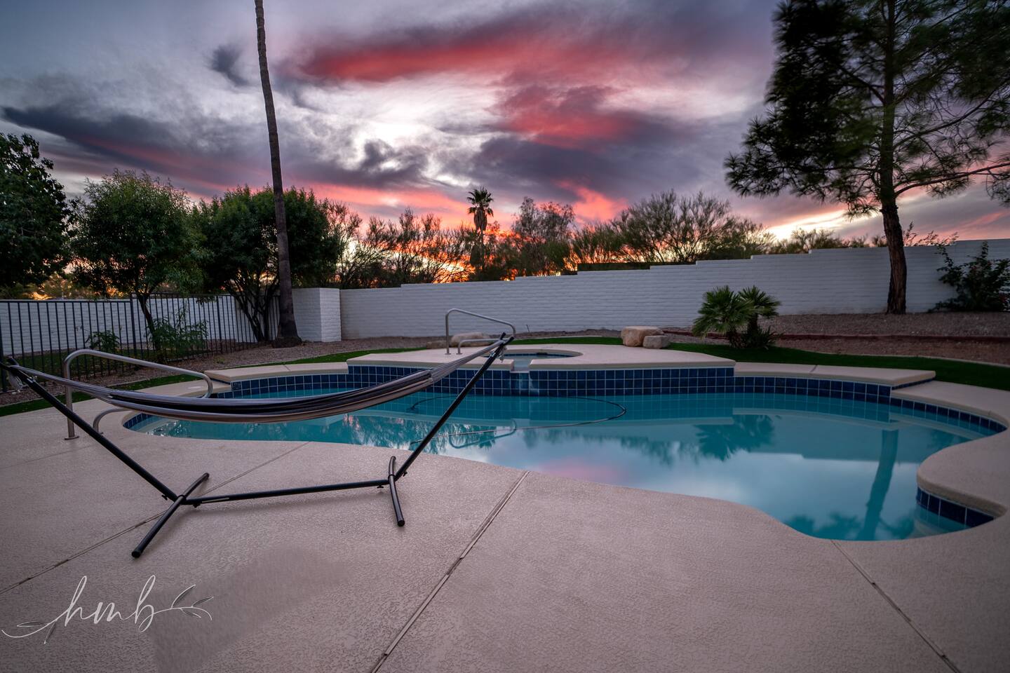 Unwind in the pool or hot tub, sway in the hammock, and soak in breathtaking sunsets. This serene backyard is the perfect spot to relax, refresh, and enjoy unforgettable evenings.