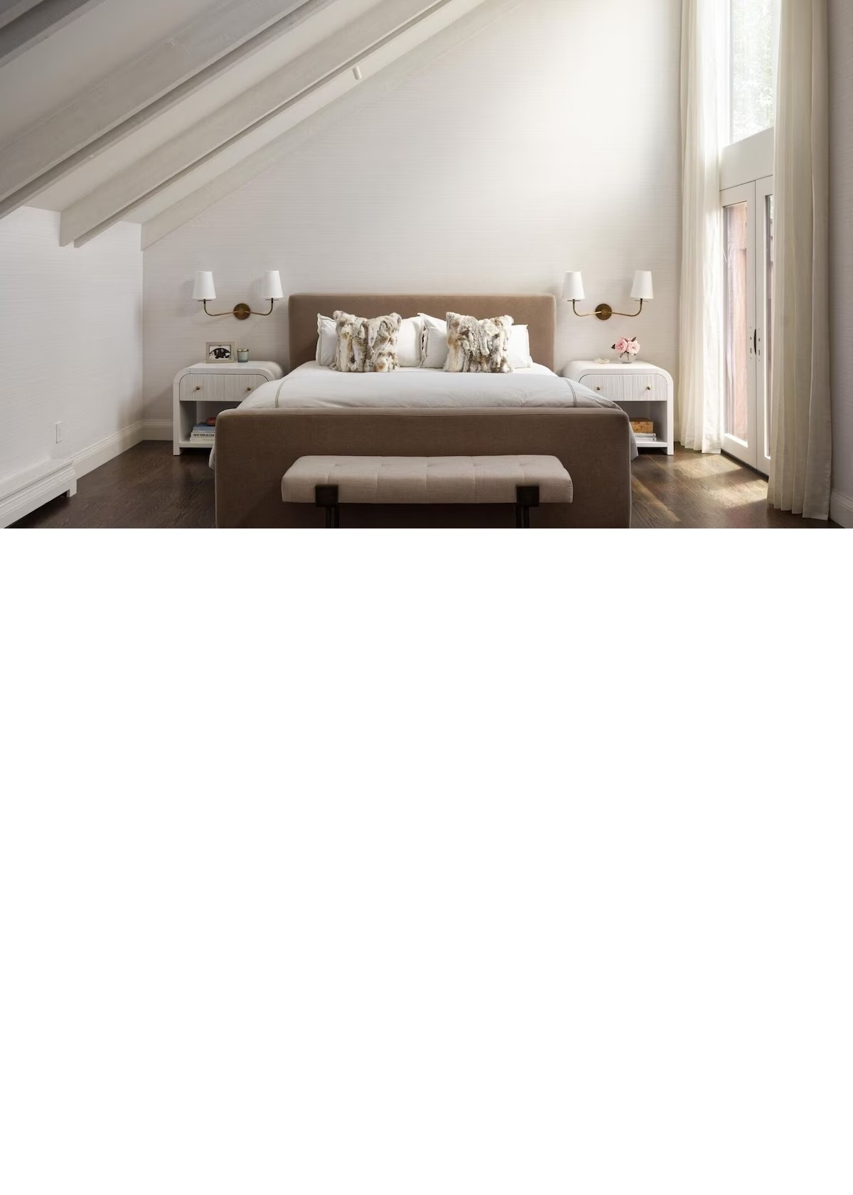 Bright vaulted bedroom with elegant decor and soft natural light